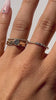The Trio Baguette Pave Ring is the ring on the middle finger 